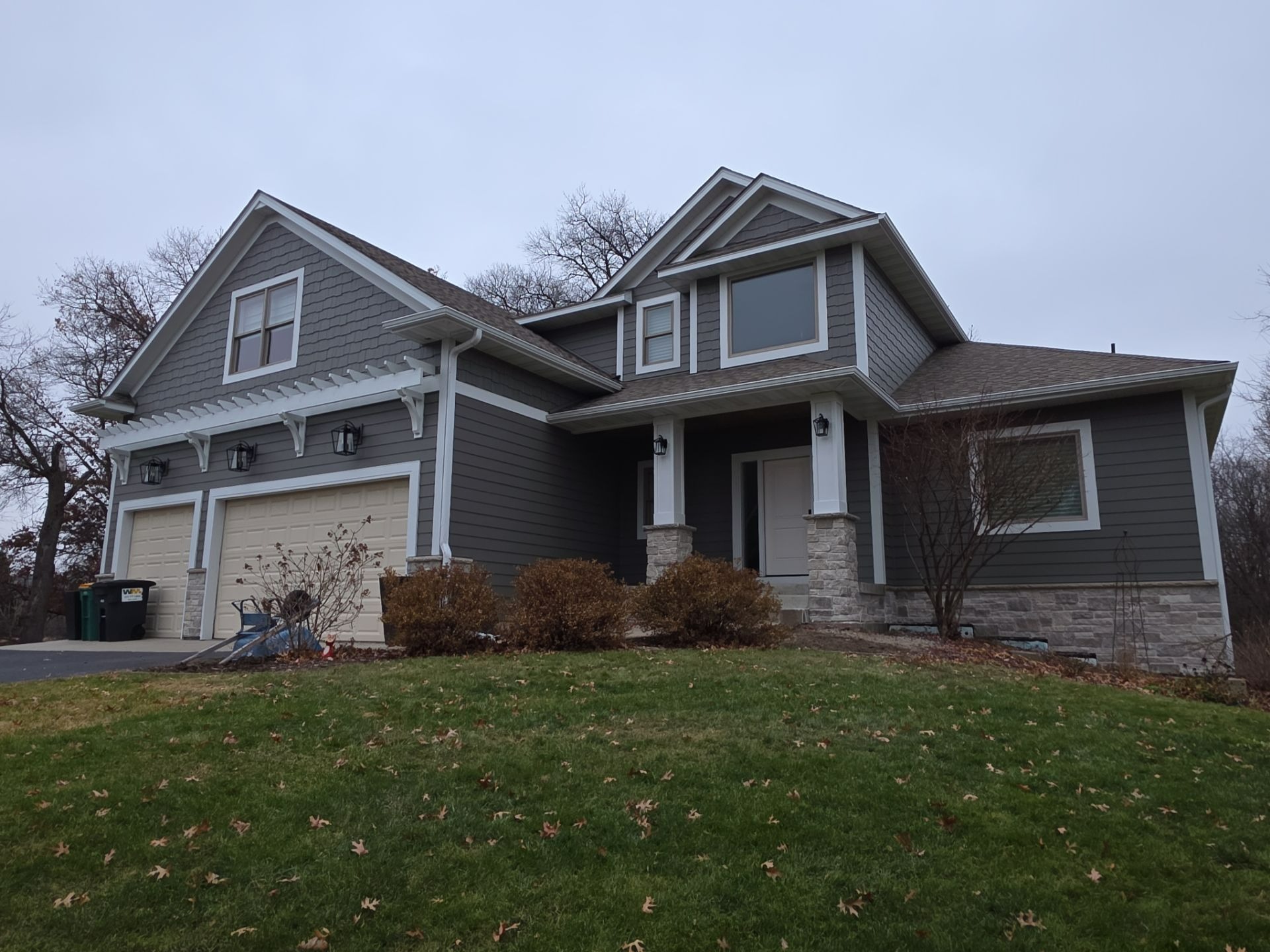 Craftsman style home with mixed siding